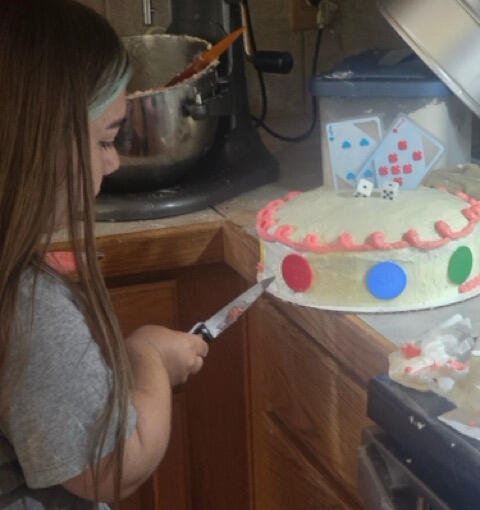 Rylee decorating a custom cake Rylee decorating a custom polka dot cake in her kitchen